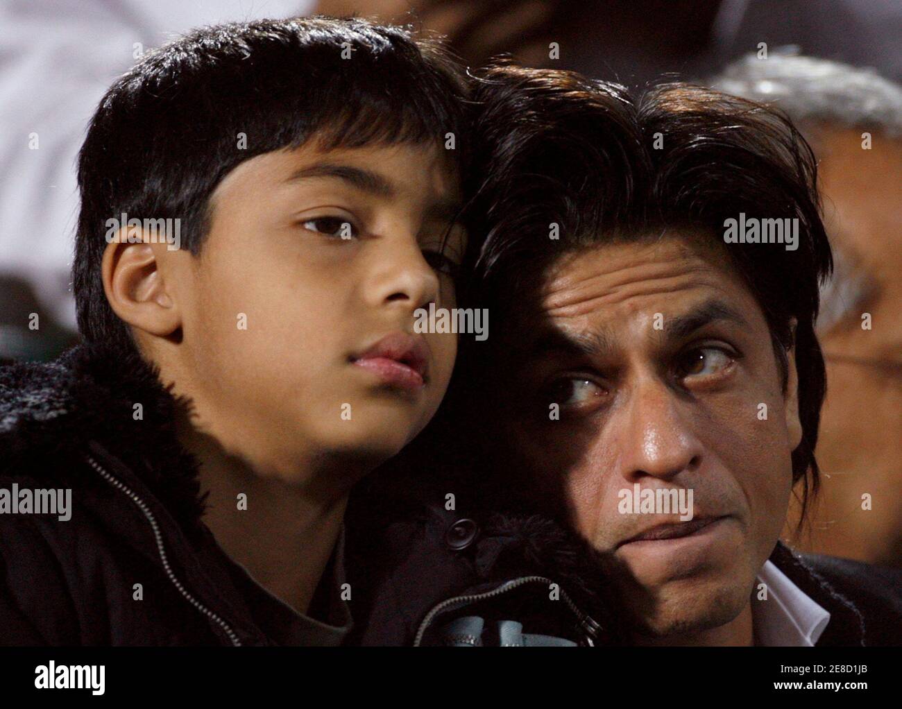 Bollywood star Shahrukh Khan and son Aryan Khan (L) watch the fifth and final one-day international cricket match between India and Pakistan in Jaipur November 18, 2007. REUTERS/Adnan Abidi (INDIA) Stock Photo