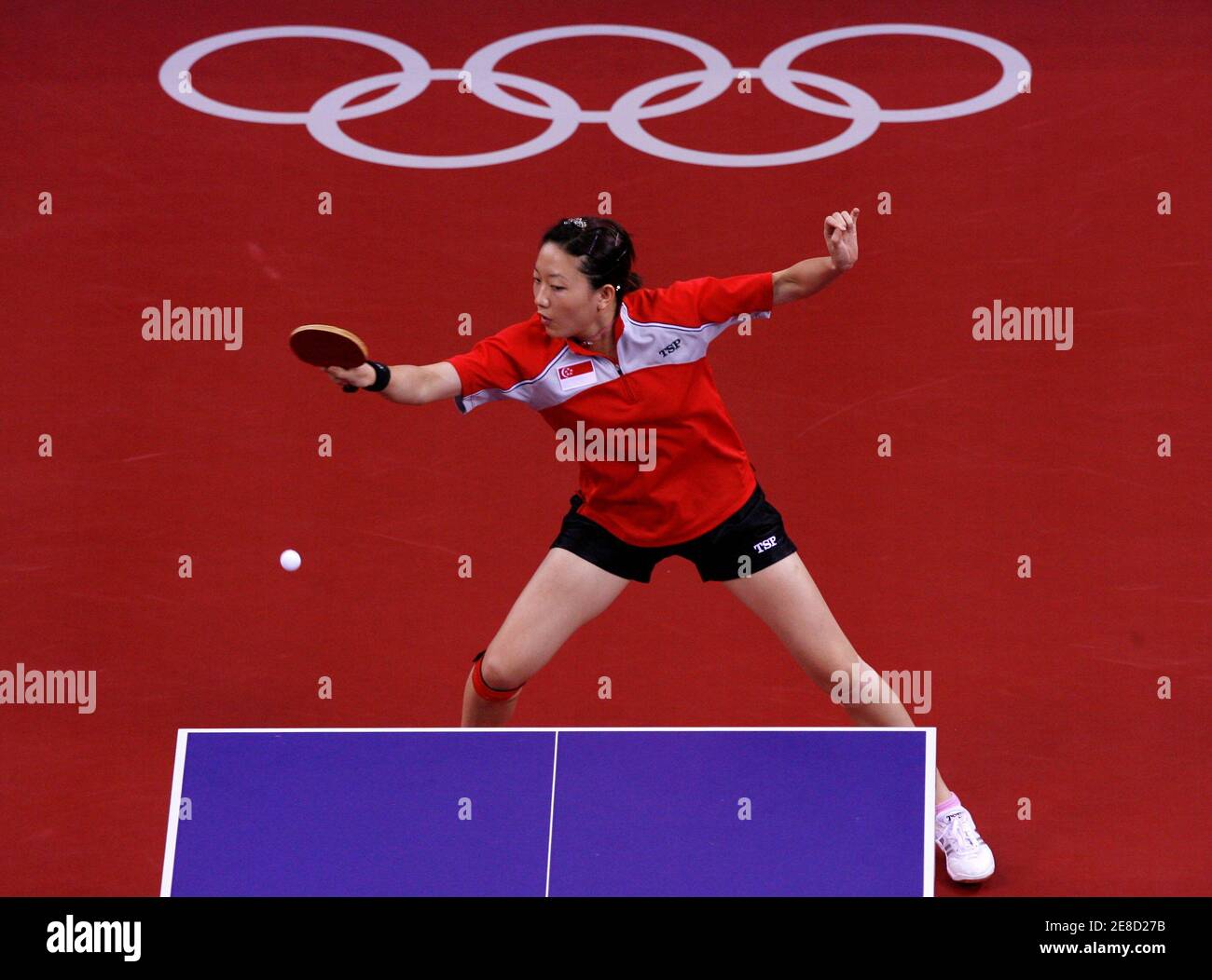 Li Jia Wei of Singapore plays a shot during her women's singles quarterfinal table tennis match against Wang Chen of the U.S. at the Beijing 2008 Olympic Games August 21, 2008.     REUTERS/Beawiharta (CHINA) Stock Photo