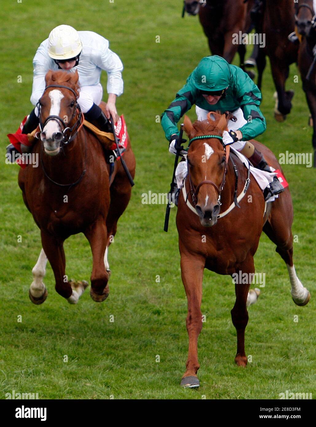 Kevin Manning riding New Approach (R) wins the Derby ahead of Ryan Moore on Tartan Bearer during the Epsom Derby Festival at Epsom Downs in Surrey, southern England, June 7, 2008.    REUTERS/Darren Staples   (BRITAIN) Stock Photo