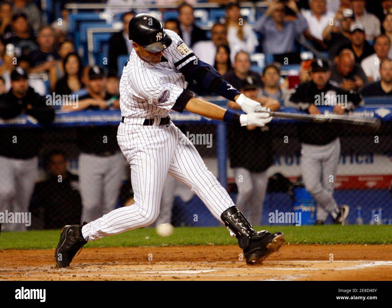 New York Yankees' Derek Jeter strikes out in the first inning against  Chicago White Sox starter Mark Buehrle in their MLB American League baseball  game at Yankee Stadium in New York September