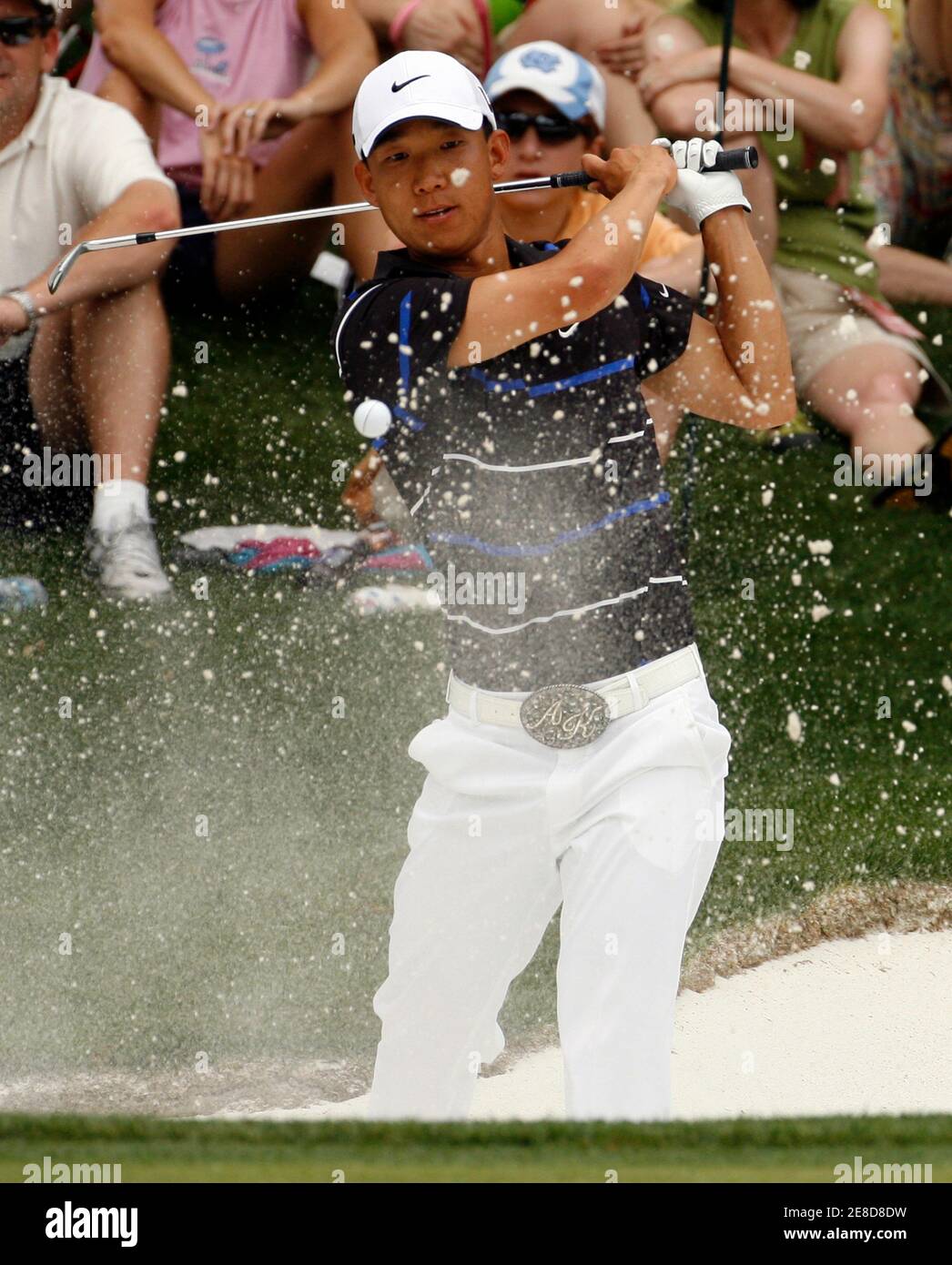 Anthony Kim of the U.S. hits from the bunker at the second hole during the final round of the Quail Hollow Championship in Charlotte, North Carolina May 2, 2010. REUTERS/Jason Miczek (UNITED STATES - Tags: SPORT GOLF) Stock Photo