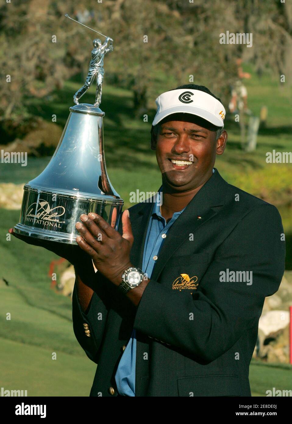 Vijay Singh of Fiji poses with the Arnold Palmer Invitational trophy after winning the tournament at the Bay Hill Club in Orlando, Florida, March 18, 2007.  REUTERS/Rick Fowler (UNITED STATES) Stock Photo