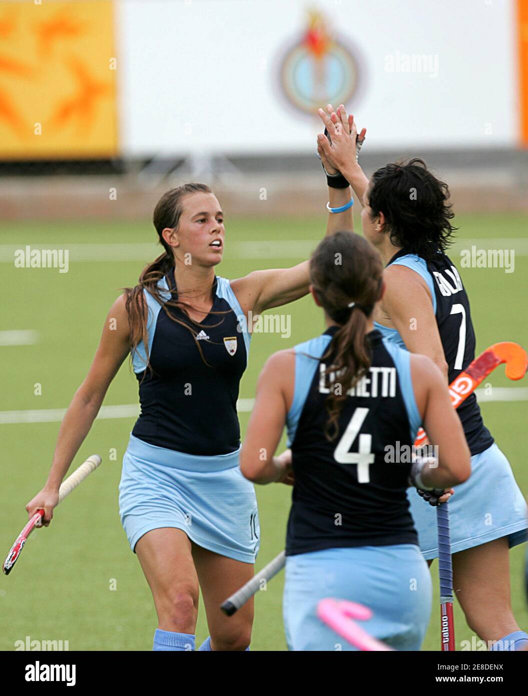 Argentina's Marine Russo (L), Rosario Luchetti (C) and Alejandra Gulla  celebrate scoring against Uruguay during their field hockey match at the Pan  American Games in Rio de Janeiro, July 17, 2007. REUTERS/Caetano