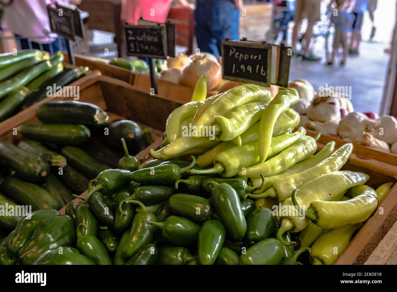 A display of peppers and zucchini in a farmers market Stock Photo - Alamy