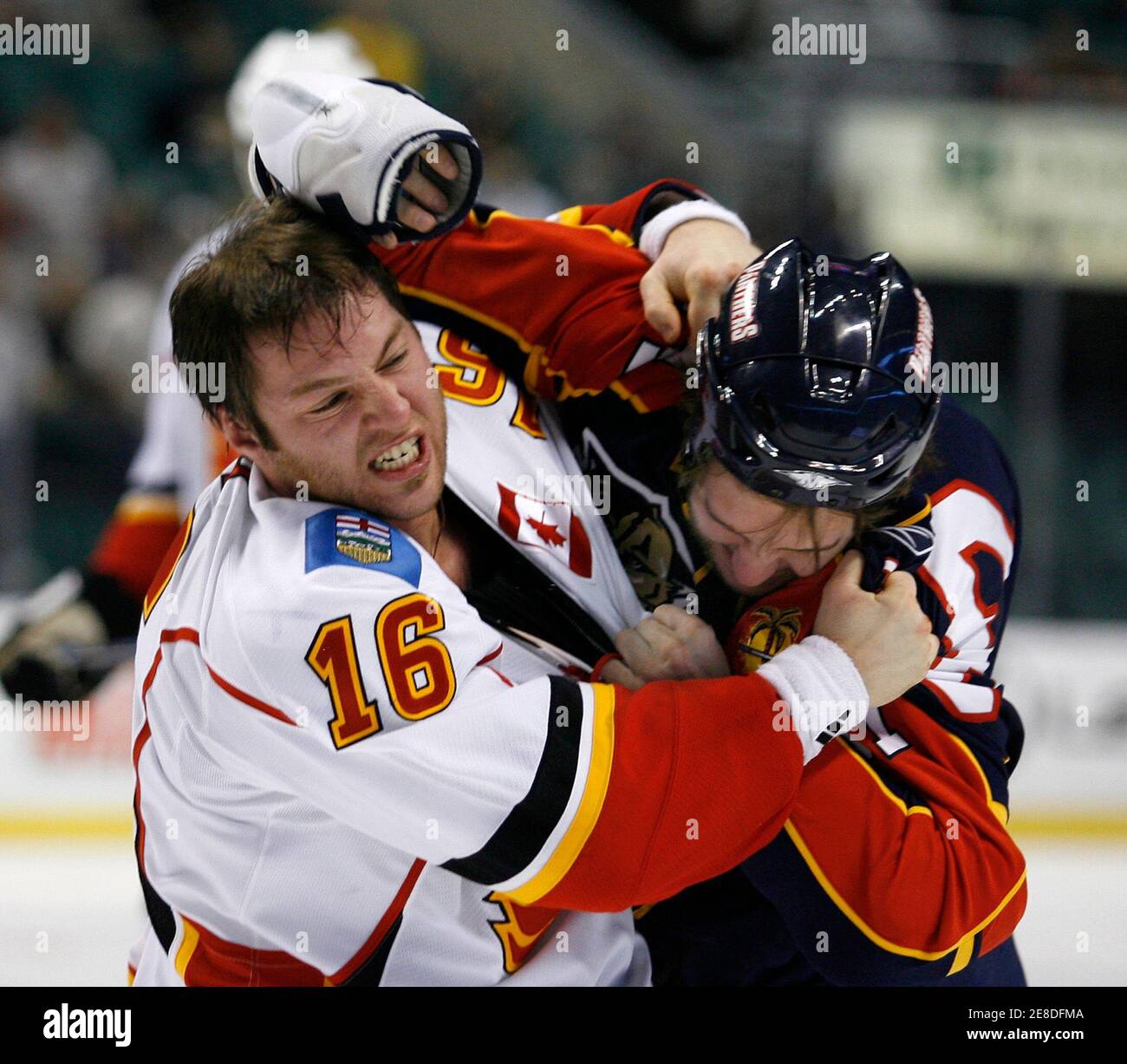 Calgary Flames Mark Smith (L) tangles with Florida Panthers Tanner Glass  during an altercation in first period NHL ice hockey action in Sunrise, Florida December 11, 2007.  REUTERS/Hans Deryk  (UNITED STATES) Stock Photo