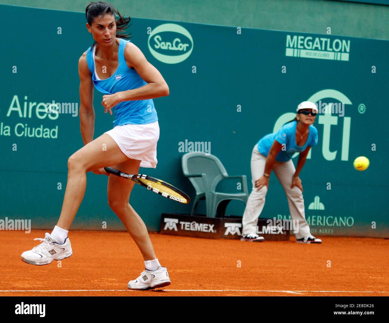Gabriela Sabatini of Argentina plays a shot between her legs during her  doubles tennis match with Martina Navratilova of the U.S. against Paola  Suarez and Patricia Tarabini of Argentina in Buenos Aires