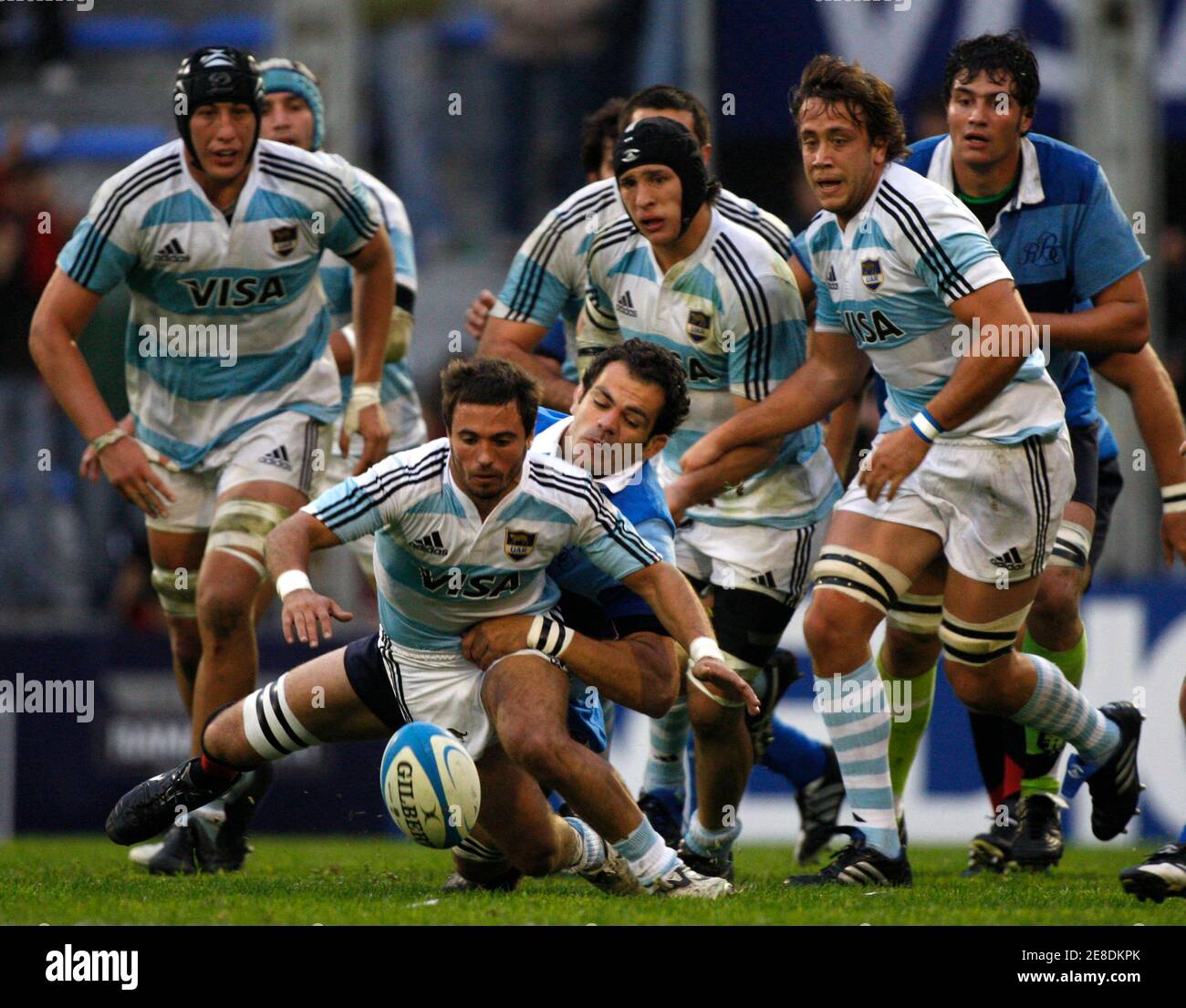 Argentina's Los Pumas Alfredo Lalanne (front) is tackled by Gregory  Lamboley form French Barbarians during their international friendly rugby  union match in Buenos Aires, June 20, 2009. REUTERS/Enrique Marcarian ( ARGENTINA SPORT RUGBY