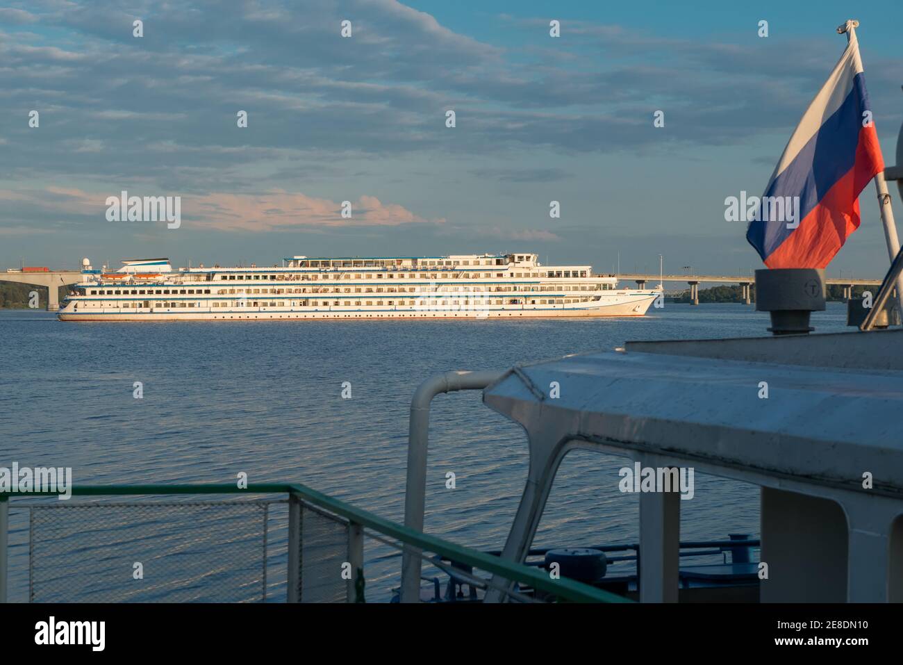 A cruise ship departs from the pier on the Volga river in the city of Kostroma on a summer evening Stock Photo