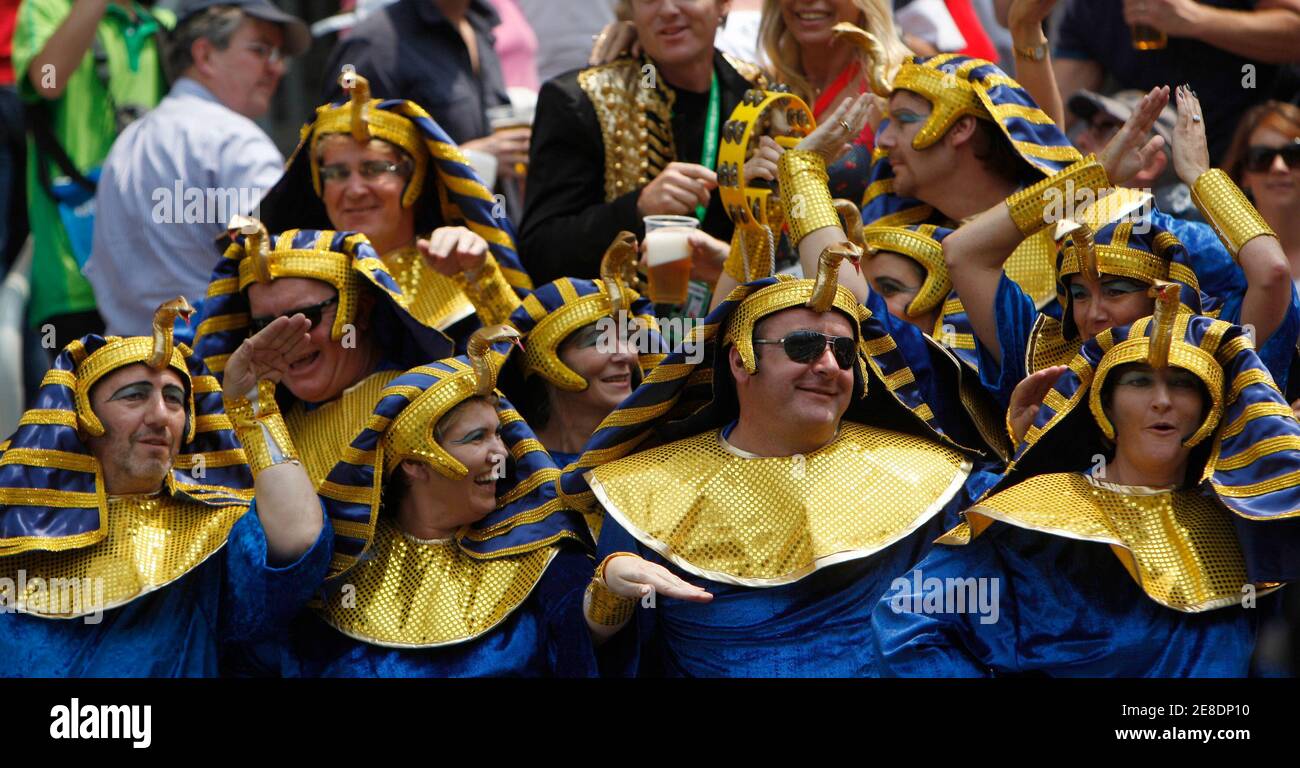 Rugby fans dressed as ancient Egyptians attend the preliminaries of the Hong Kong Sevens rugby tournament March 28, 2010. The annual three-day international sporting event attracts fans from around the world, creating a carnival atmosphere. REUTERS/Tyrone Siu  (CHINA - Tags: SPORT RUGBY IMAGES OF THE DAY SOCIETY) Stock Photo