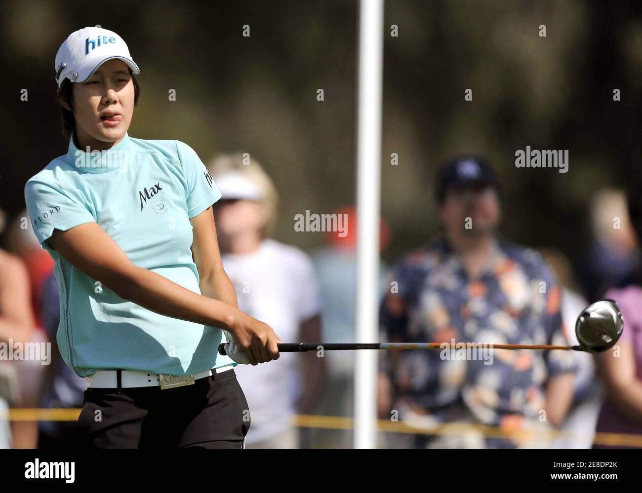 Kim Song-Hee of South Korea watches her drive on the second hole during final round play of the LPGA's Kraft Nabisco Championship golf tournament in Rancho Mirage, California, April 4, 2010.  REUTERS/Gus Ruelas (UNITED STATES - Tags: SPORT GOLF) Stock Photo