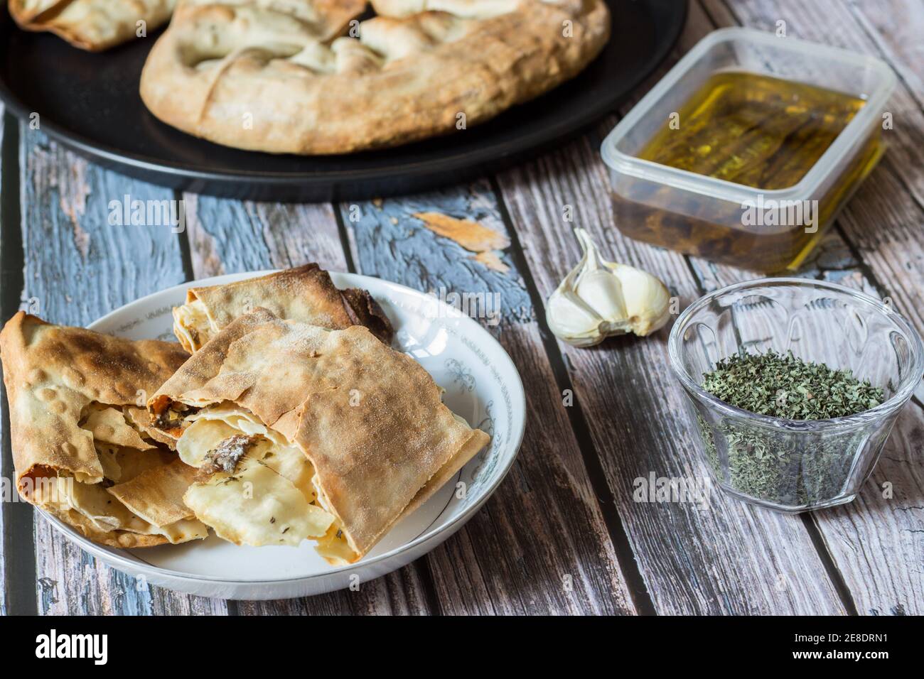 Pizza Puff with Anchovies. Traditional peasant dish. Stock Photo