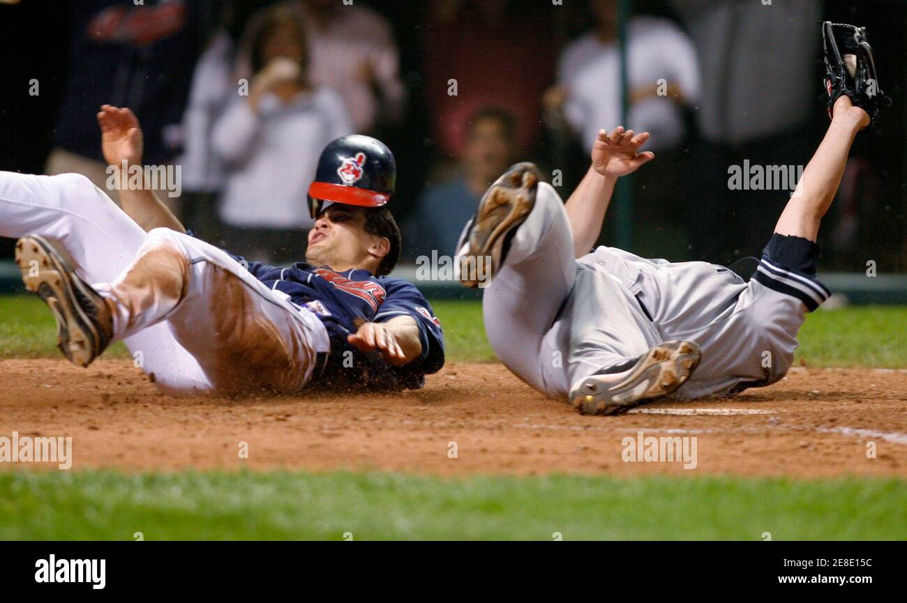 Cleveland Indians Grady Sizemore L Scores Past New York Yankees Pitcher Joba Chamberlain After A Wild Pitch During The Eighth Inning Of Game 2 Of Their Mlb American League Division Series Playoff
