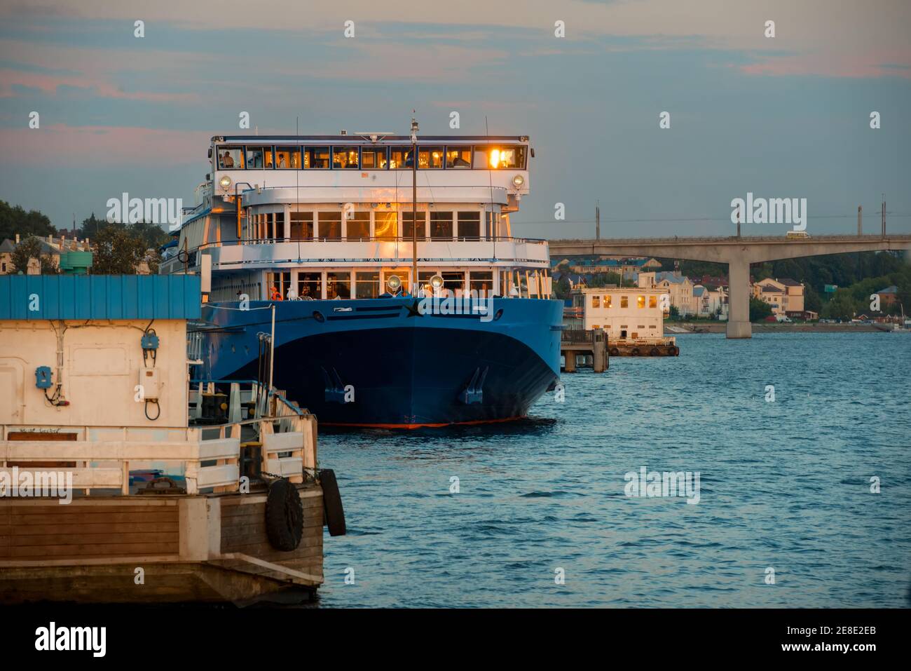 Cruise ship at the pier on the Volga river in the city of Kostroma on a summer evening Stock Photo