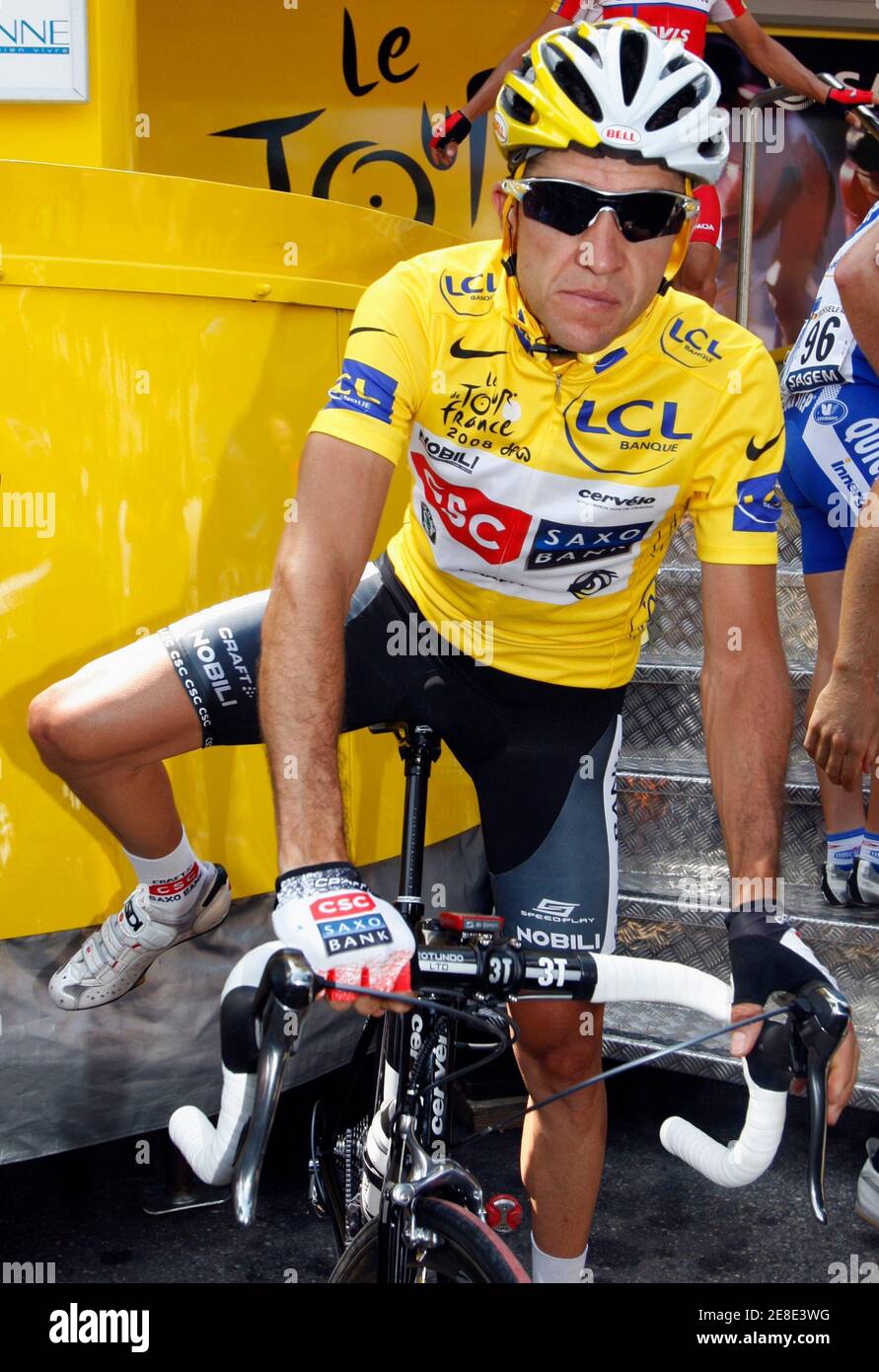 Team CSC Saxo Bank rider and leader's yellow jersey holder Carlos Sastre of  Spain awaits the start of the nineteenth stage of the 95th Tour de France  cycling race between Roanne and