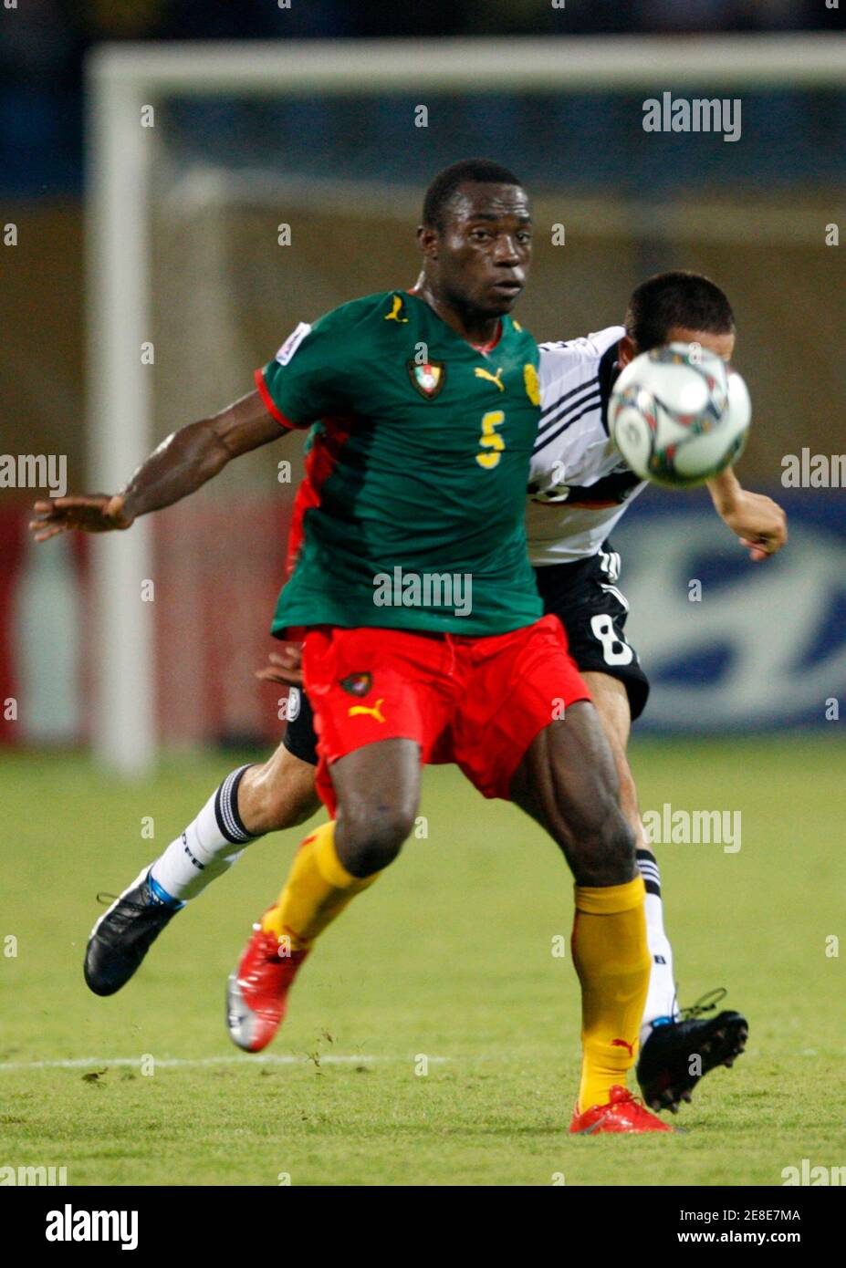 Mario Vrancic of Germany (R) challenges Enow Tabot of Cameroon (L) during their FIFA U-20 World Cup group C soccer match in Ismailia October 2, 2009. REUTERS/Marko Djurica (EGYPT SPORT SOCCER) Stock Photo