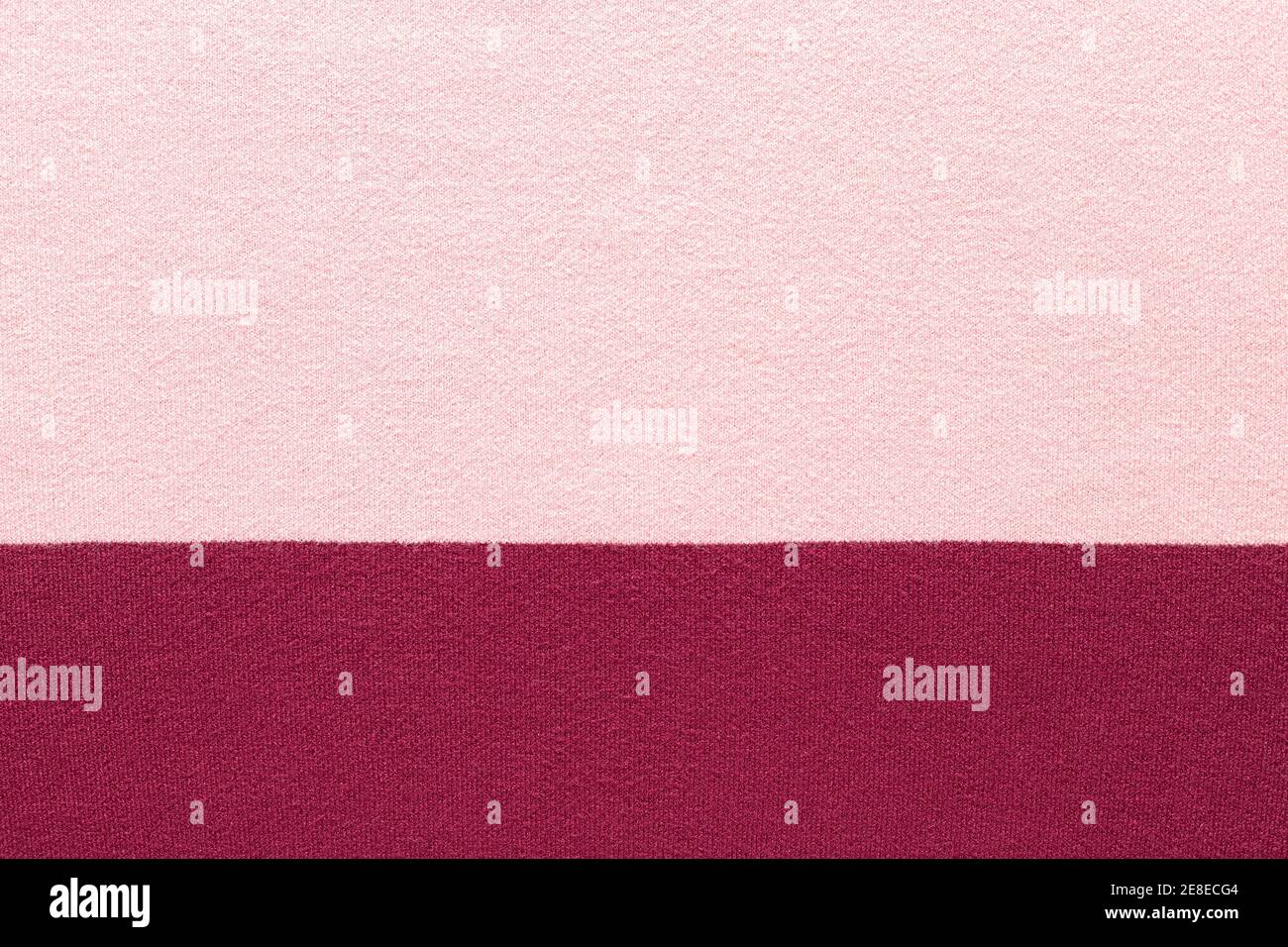 pink and burgundy knitted texture. Soft and warm fabric. Stock Photo