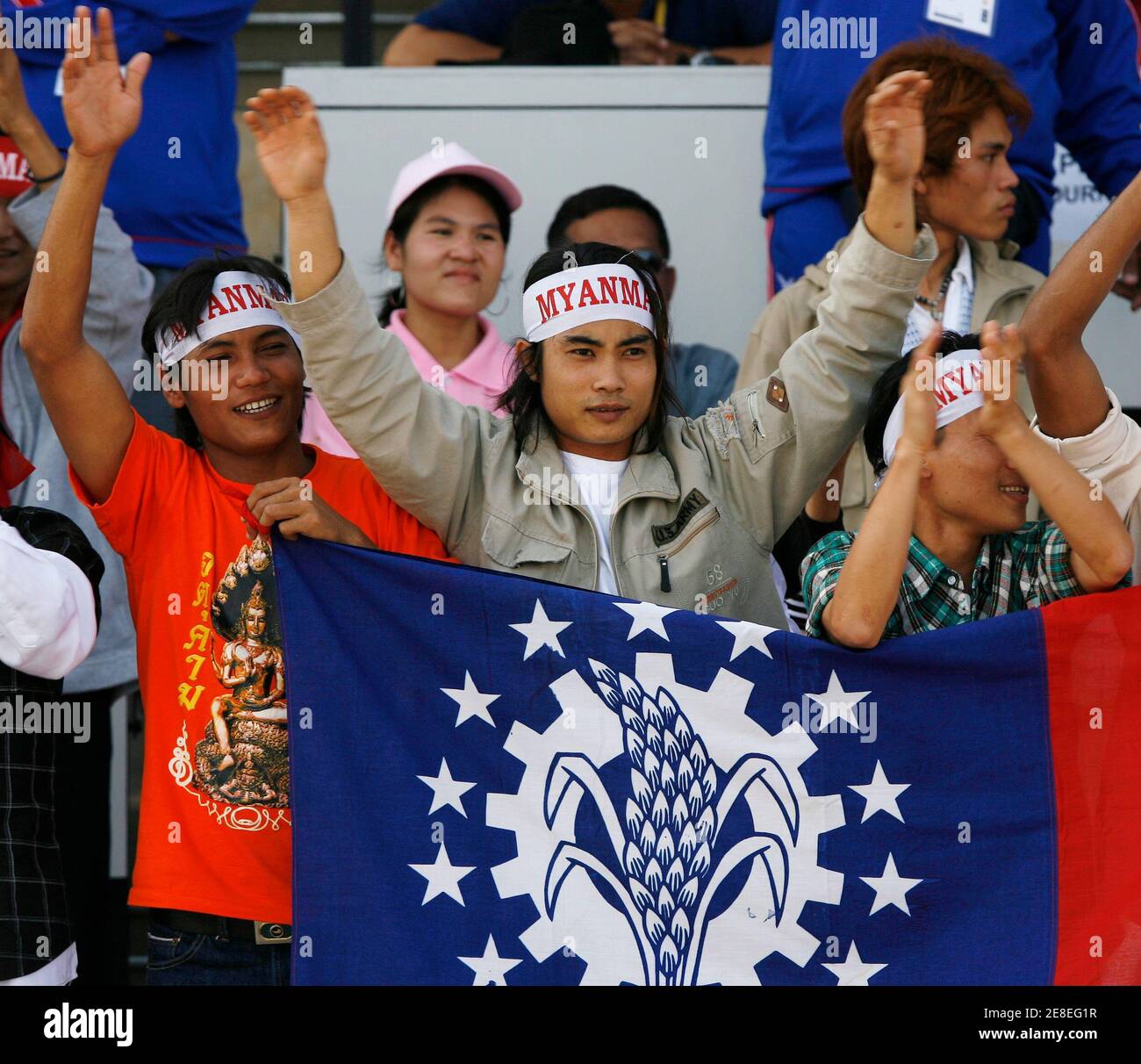 Myanmar Fans Holding Their National Flag Cheer For Their Team During Their Men S Football Match Against Vietnam At The Sea Games In Nakhon Ratchasima December 11 07 Reuters Chaiwat Subprasom Thailand Stock Photo