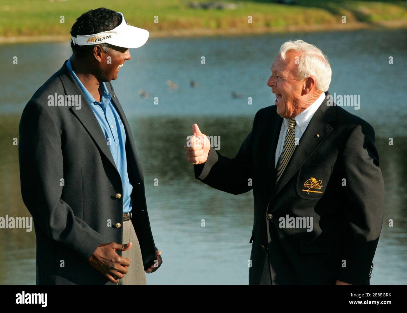 Vijay Singh (L) of Fiji shares a laugh with host Arnold Palmer after winning the Arnold Palmer Invitational golf tournament at the Bay Hill Club in Orlando, Florida, March 18, 2007.    REUTERS/Rick Fowler (UNITED STATES) Stock Photo