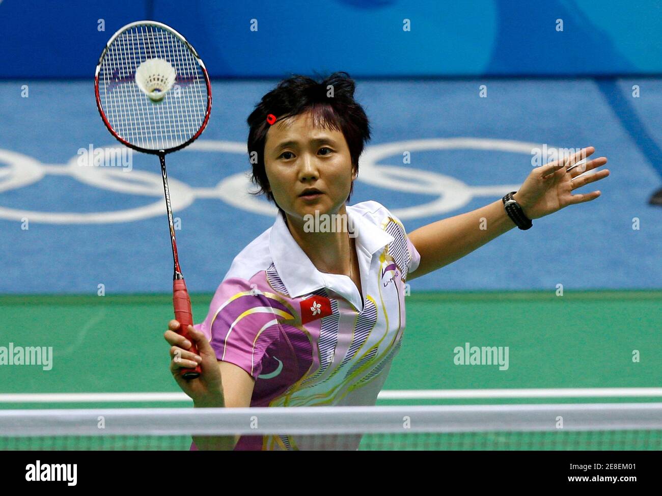 Wang Chen of Hong Kong returns a shot during her women's singles round of 32 badminton match against Eva Sladekova of Slovakia at the Beijing 2008 Olympic Games, August 10, 2008.     REUTERS/Beawiharta (CHINA) Stock Photo