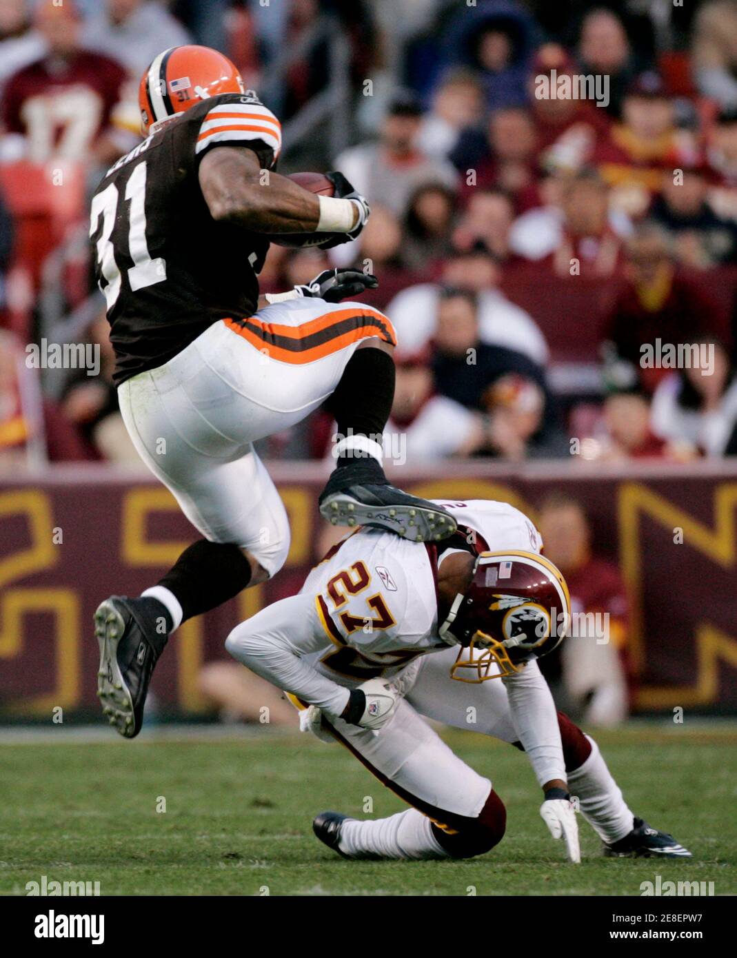 Cleveland Browns running back Jamal Lewis (L) hurdles Washington Redskins cornerback Fred Smoot (R) in the third quarter of their NFL football game in Landover, Maryland October 19, 2008.  REUTERS/Gary Cameron (UNITED STATES) Stock Photo
