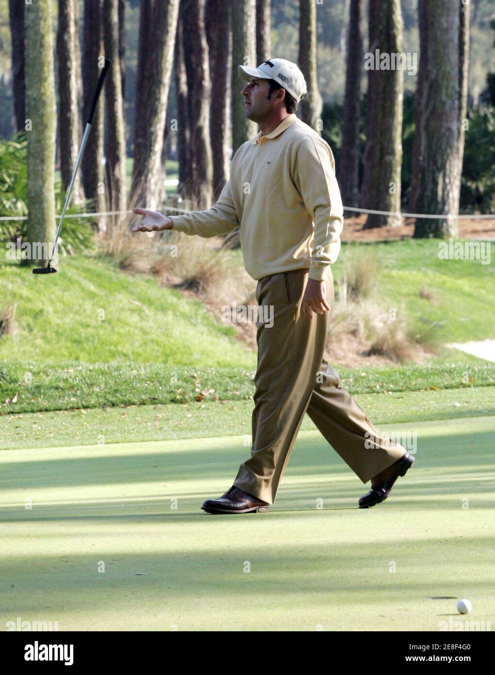 Jose Maria Olazabal of Spain tosses his club after missing a putt on the 10th green during the second round of the Players Championship golf tournament in Ponte Vedra Beach, Florida March 24, 2006. REUTERS/Rick Fowler Stock Photo