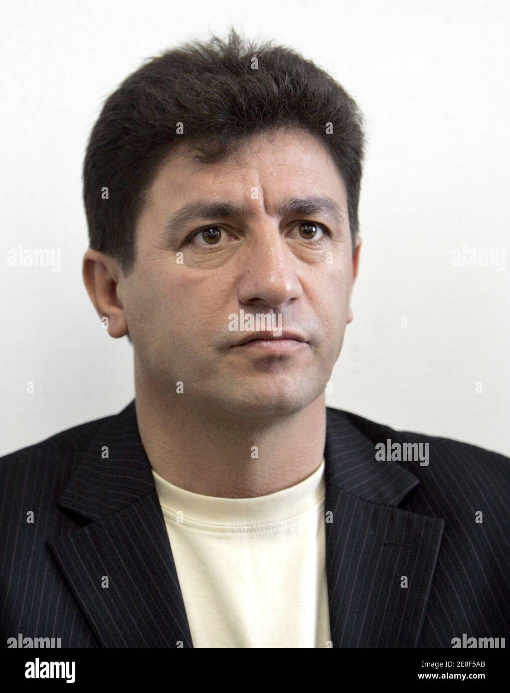 Amir Qalenoei attends his first media conference as head coach of Iran's national soccer team in Tehran July 23, 2006. Qalenoei replaced Branco Ivankovic after Iran's poor showing at the World Cup in Germany.  REUTERS/Raheb Homavandi (IRAN) Stock Photo