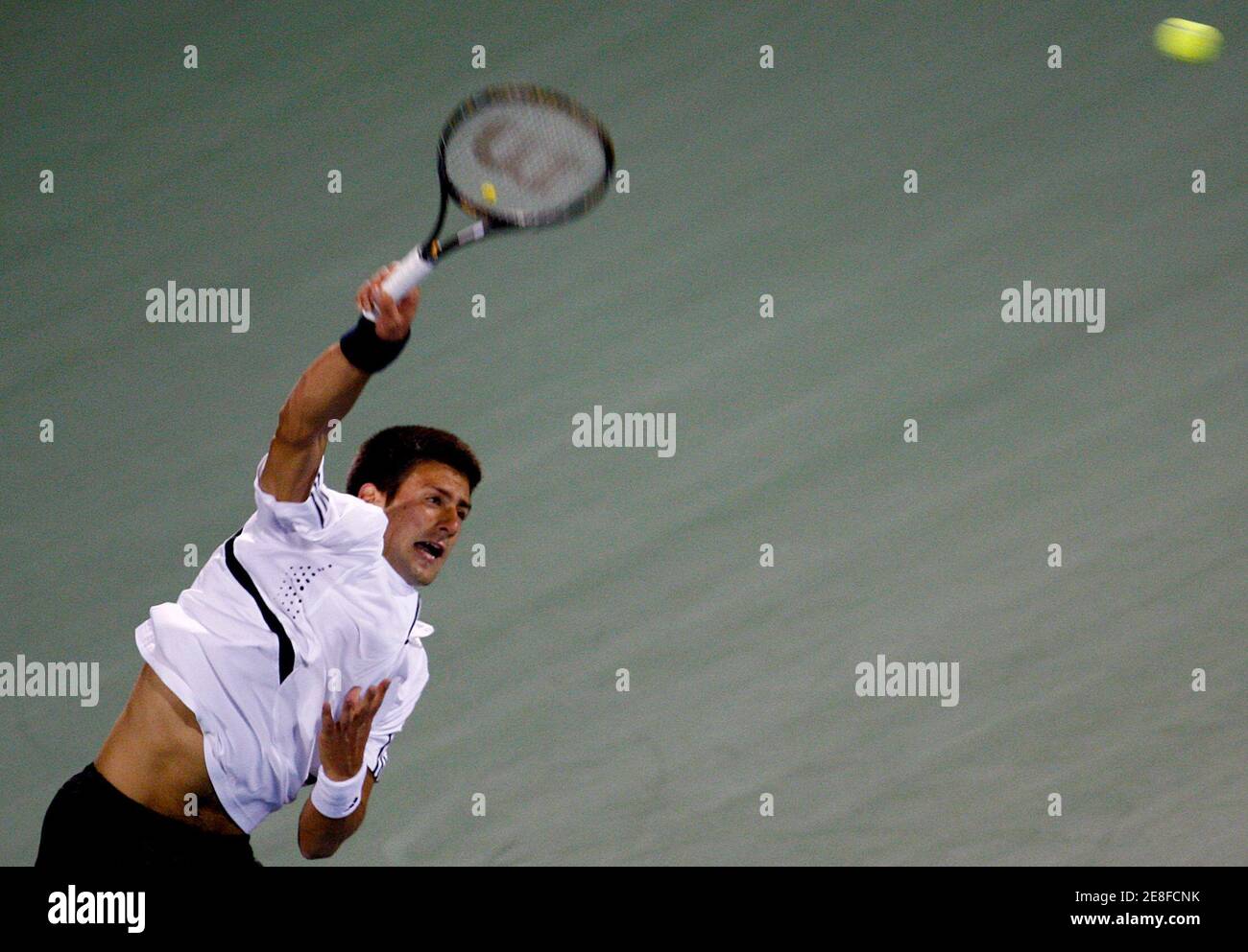 Serbia's Novak Djokovic serves to France's Fabrice Santoro during their match at the ATP Dubai Tennis Championships, March 5, 2008. REUTERS/Jumana El Heloueh (UNITED ARAB EMIRATES) Stock Photo