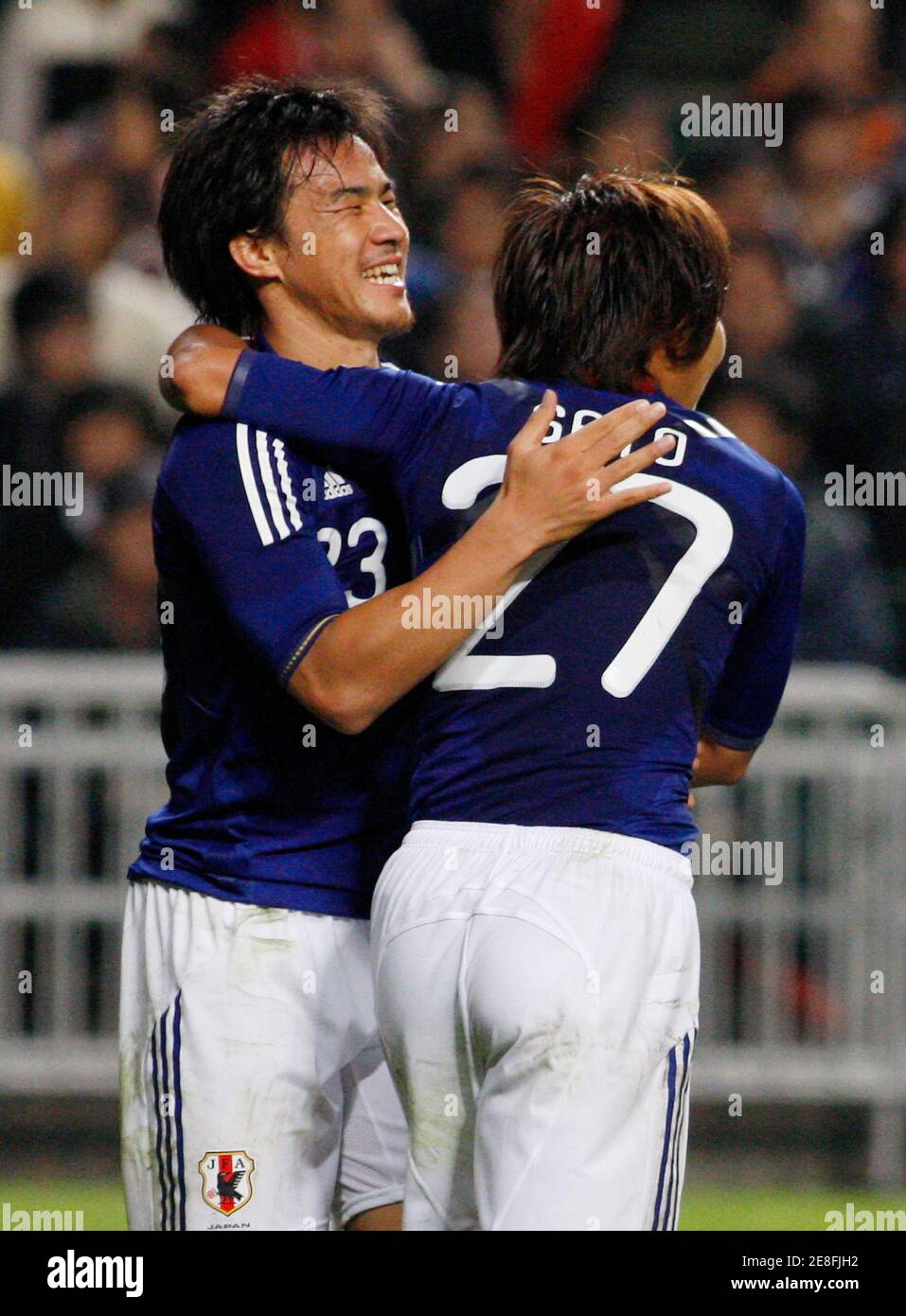 Shinji Okazaki and Hisato Sato (R) of Japan celebrate after Sato scored a goal against Hong Kong during the second half of their AFC Asian Cup 2011 qualifying match in Hong Kong November 18, 2009.  REUTERS/Tyrone Siu    (CHINA SPORT SOCCER) Stock Photo