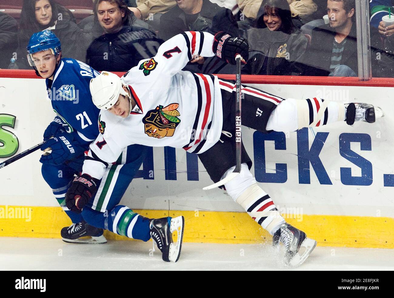 Chicago Blackhawks' Brent Seabrook (R) and Vancouver Canucks' Mason Raymond collide during second period NHL hockey in Vancouver, British Columbia November 22, 2009.          REUTERS/Andy Clark     (CANADA SPORT ICE HOCKEY) Stock Photo