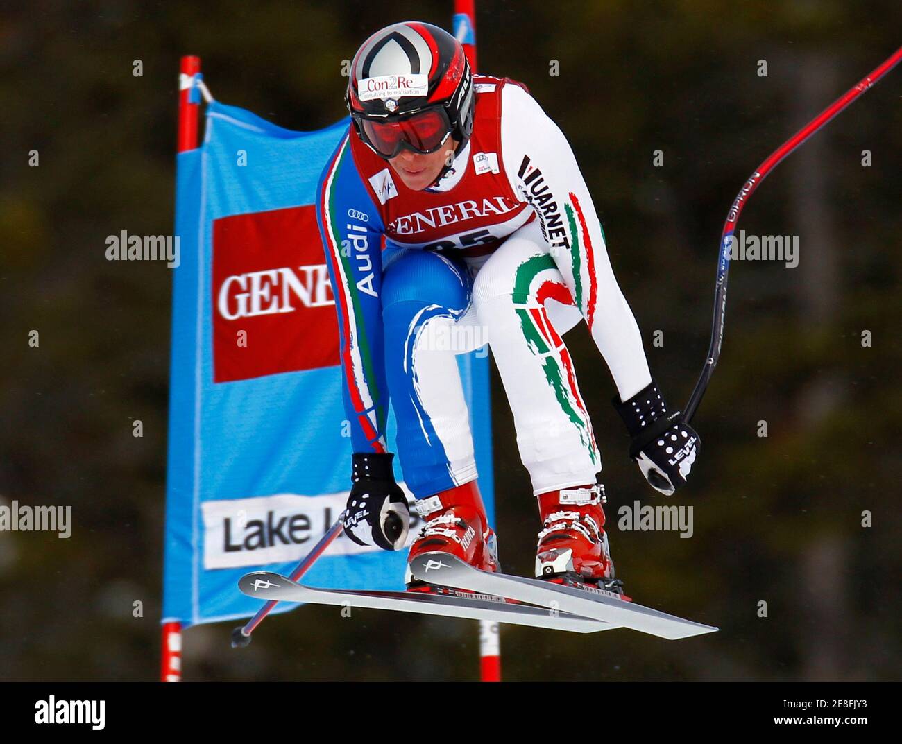 Lucia Recchia of Italy speeds past a gate during the women's World Cup downhill alpine skiing race in Lake Louise, Alberta December 5, 2009. REUTERS/Mike Blake (CANADA SPORT SKIING) Stock Photo