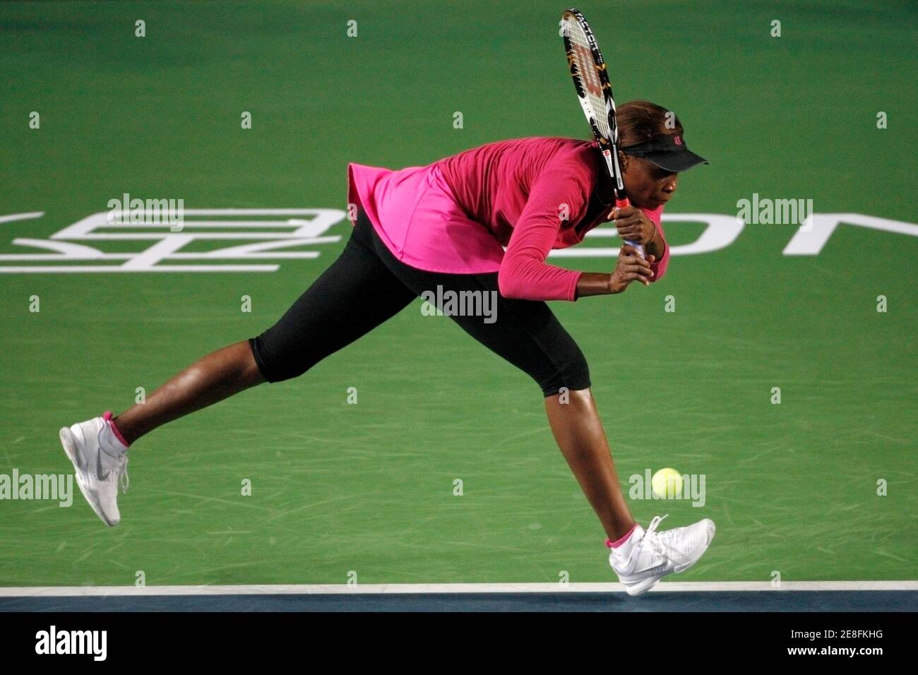 Venus Williams of the U.S. returns a shot to Caroline Wozniacki of Denmark during their match on the second day of the Tennis Classic in Hong Kong January 7, 2010.  REUTERS/Tyrone Siu    (CHINA - Tags: SPORT TENNIS) Stock Photo
