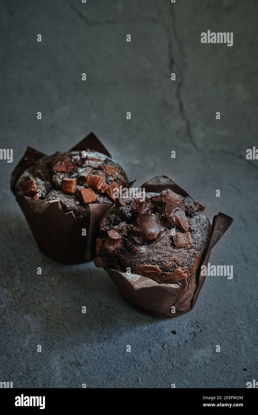 chocolate muffins on a dark background Stock Photo