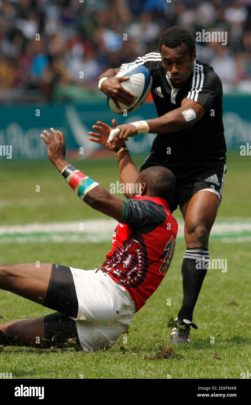 New Zealand's Tomasi Cama (R) is tackled by Kenya's Lavin Asego during the Cup quarter finals of the Hong Kong Sevens rugby tournament March 28, 2010.   REUTERS/Tyrone Siu  (CHINA - Tags: SPORT RUGBY) Stock Photo