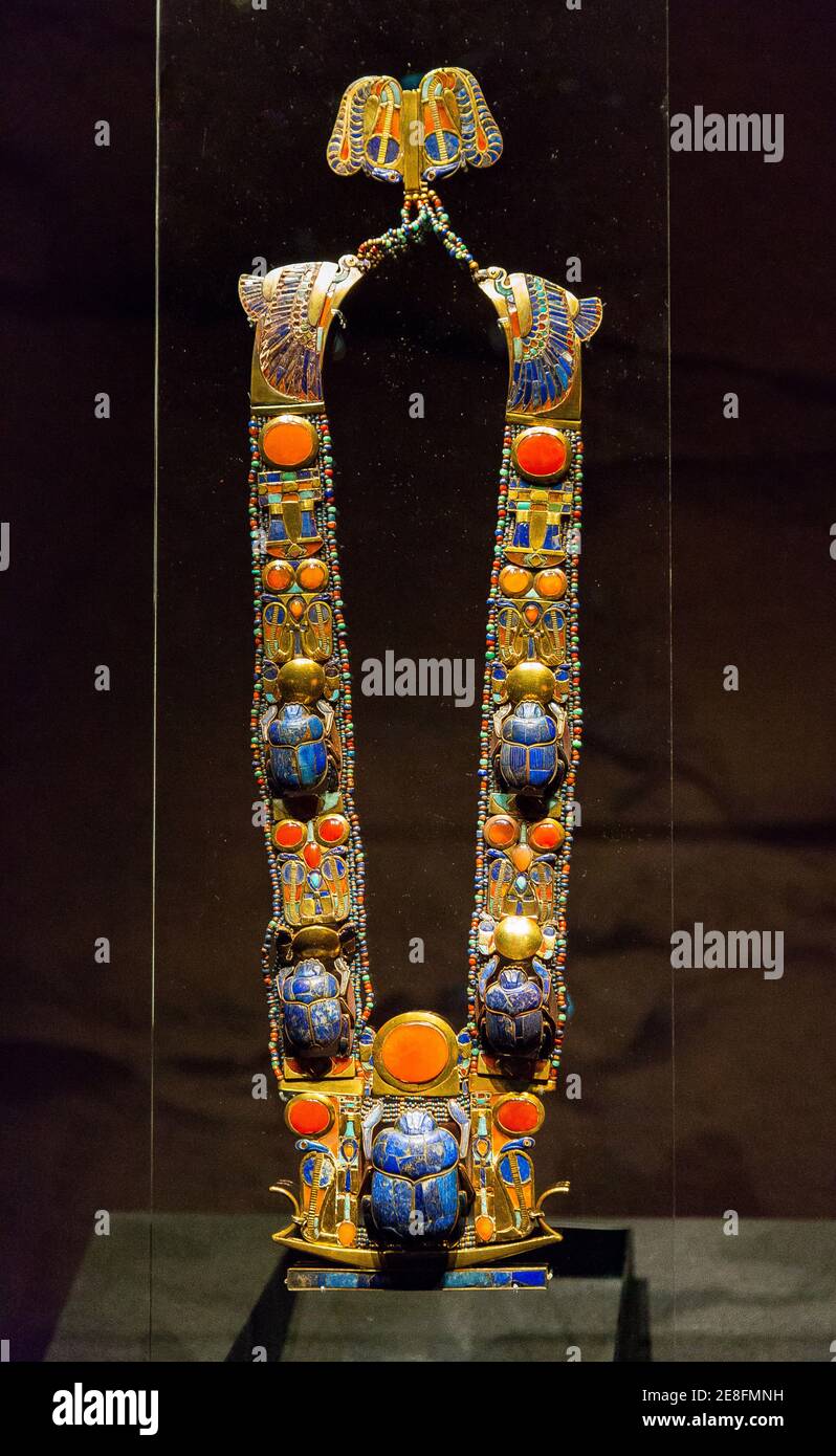 Egypt, Cairo, Egyptian Museum, Tutankhamon jewellery, from his tomb in Luxor : A complex flexible pectoral showing a barque, solar snakes and a scarab. Stock Photo