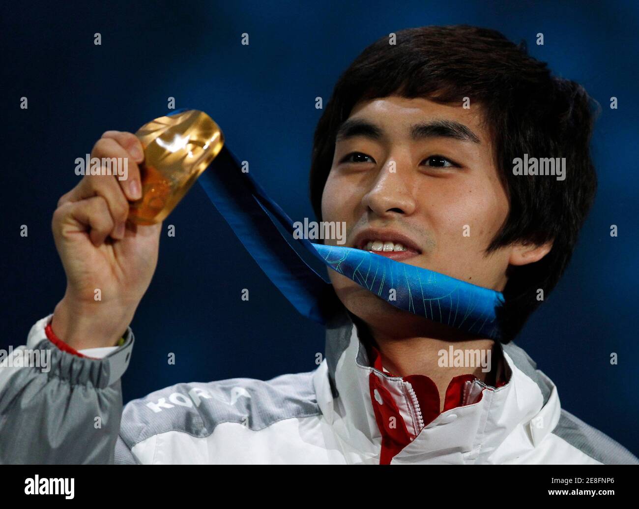 Lee Seung-hoon of South Korea displays his gold medal during the medal ceremony for the men's 10000 metres speed skating competition at the Vancouver 2010 Winter Olympics February 23, 2010.     REUTERS/Jerry Lampen (CANADA) Stock Photo