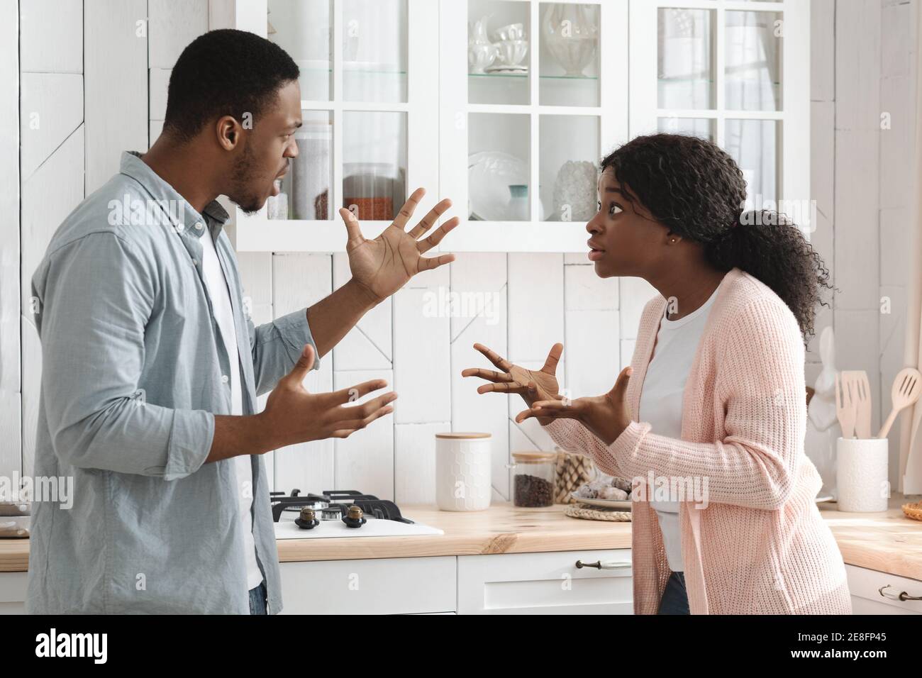 Relationship Problems. Young African American Couple Arguing In Kitchen Stock Photo