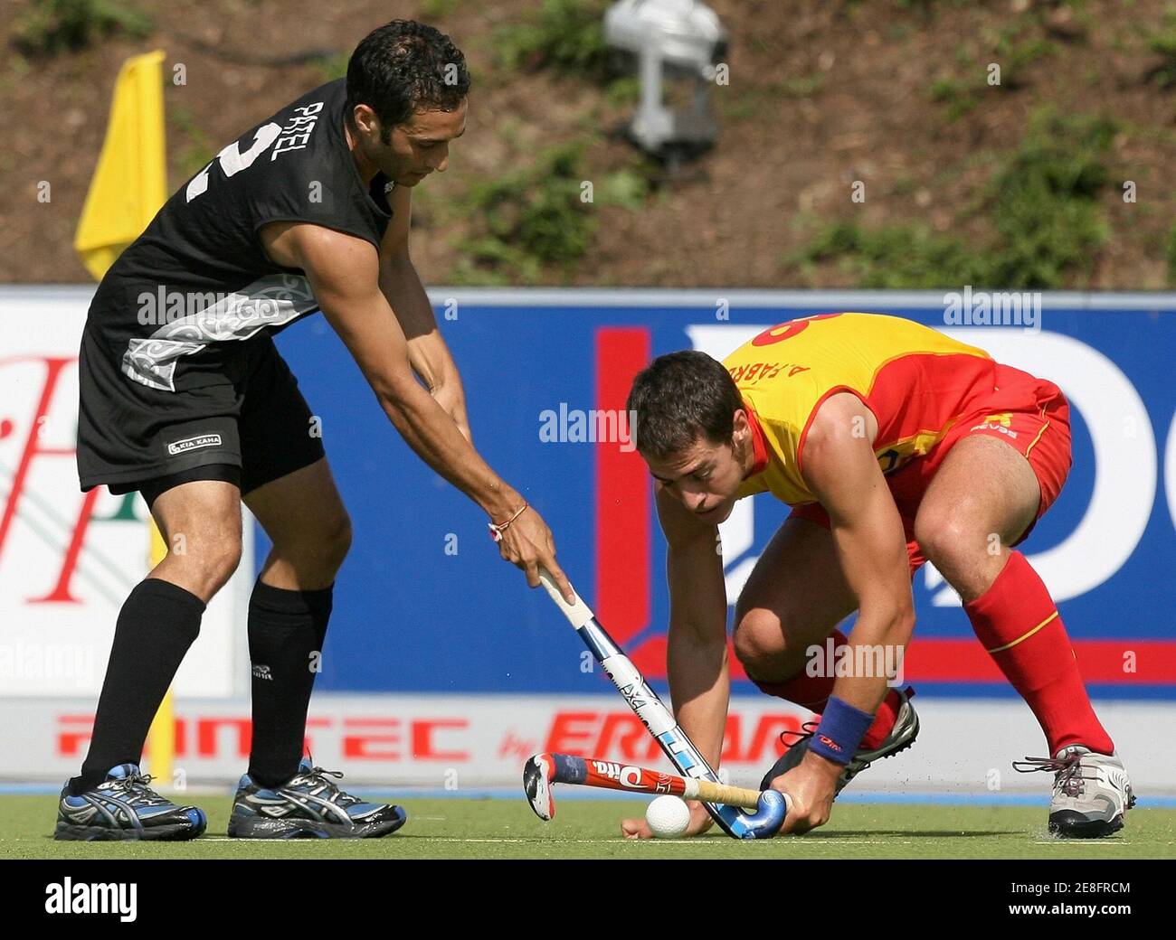 Spain's Alex Fabergas (R) fights for the ball with New Zealand's Mitesh Patel during their Men's Field Hockey World Cup match at the Warsteiner Hockey Park stadium in Moenchengladbach September 11, 2006. REUTERS/Pascal Lauener  (GERMANY) Stock Photo