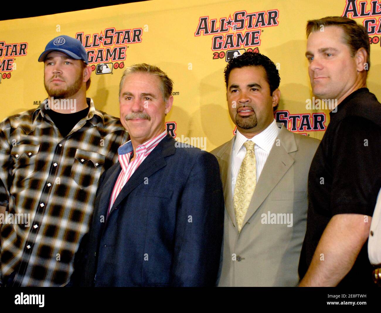National League All Star starting pitcher Brad Penny (L) of the Los Angeles  Dodgers, National League manager Phil Garner (2nd L) of the Houston Astros,  American League manager Ozzie Guillen of the