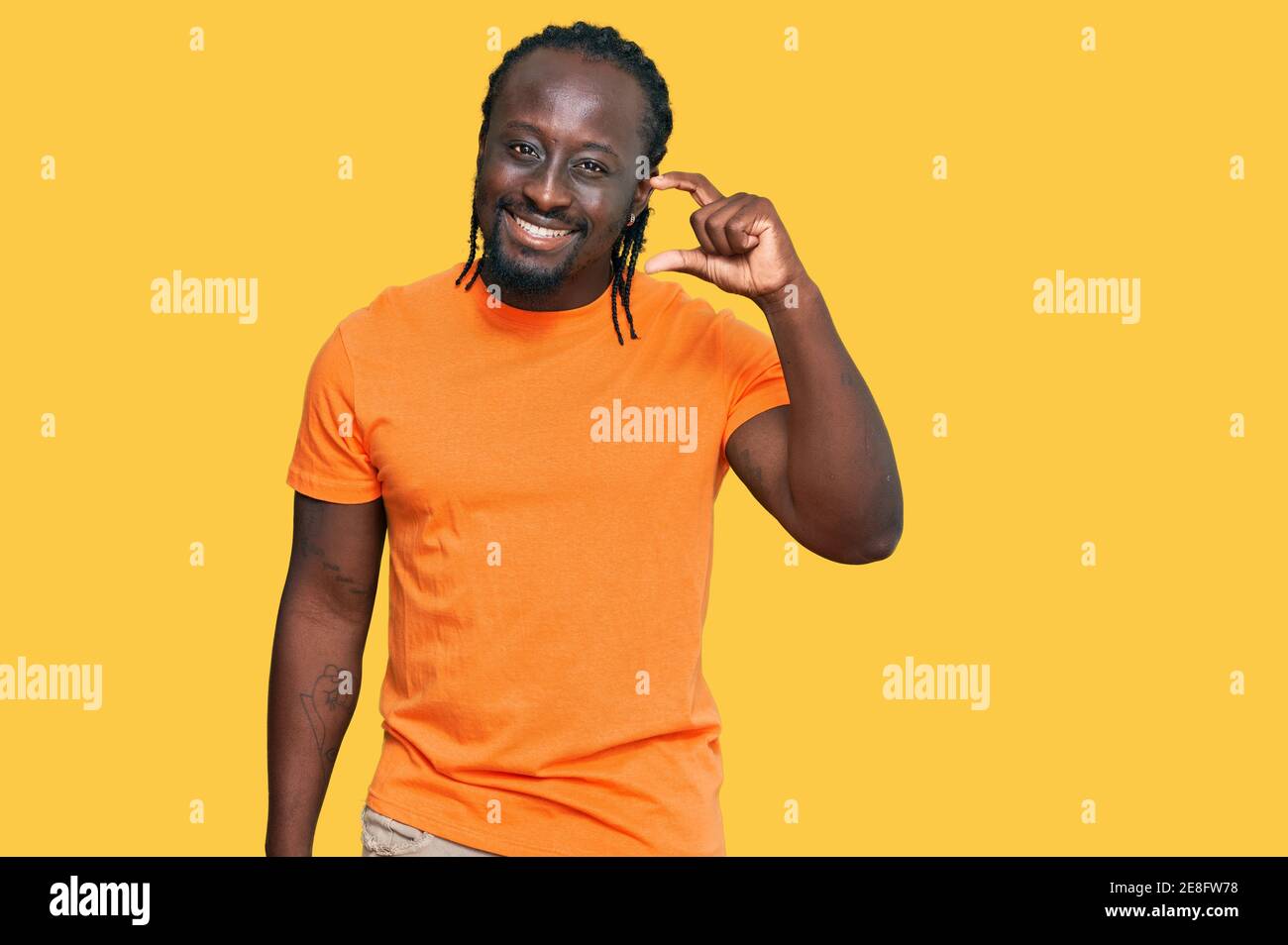 Handsome young african american man wearing casual clothes smiling and ...