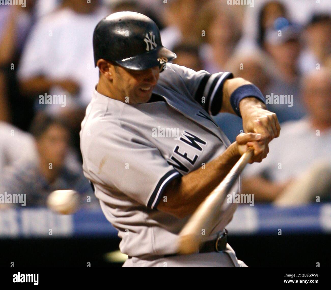 New York Yankees batter Jorge Posada strikes out leaving two men on against the Colorado Rockies in the top of the sixth inning in their MLB interleague baseball game in Denver, Colorado June 20, 2007. REUTERS/Rick Wilking (UNITED STATES) Stock Photo