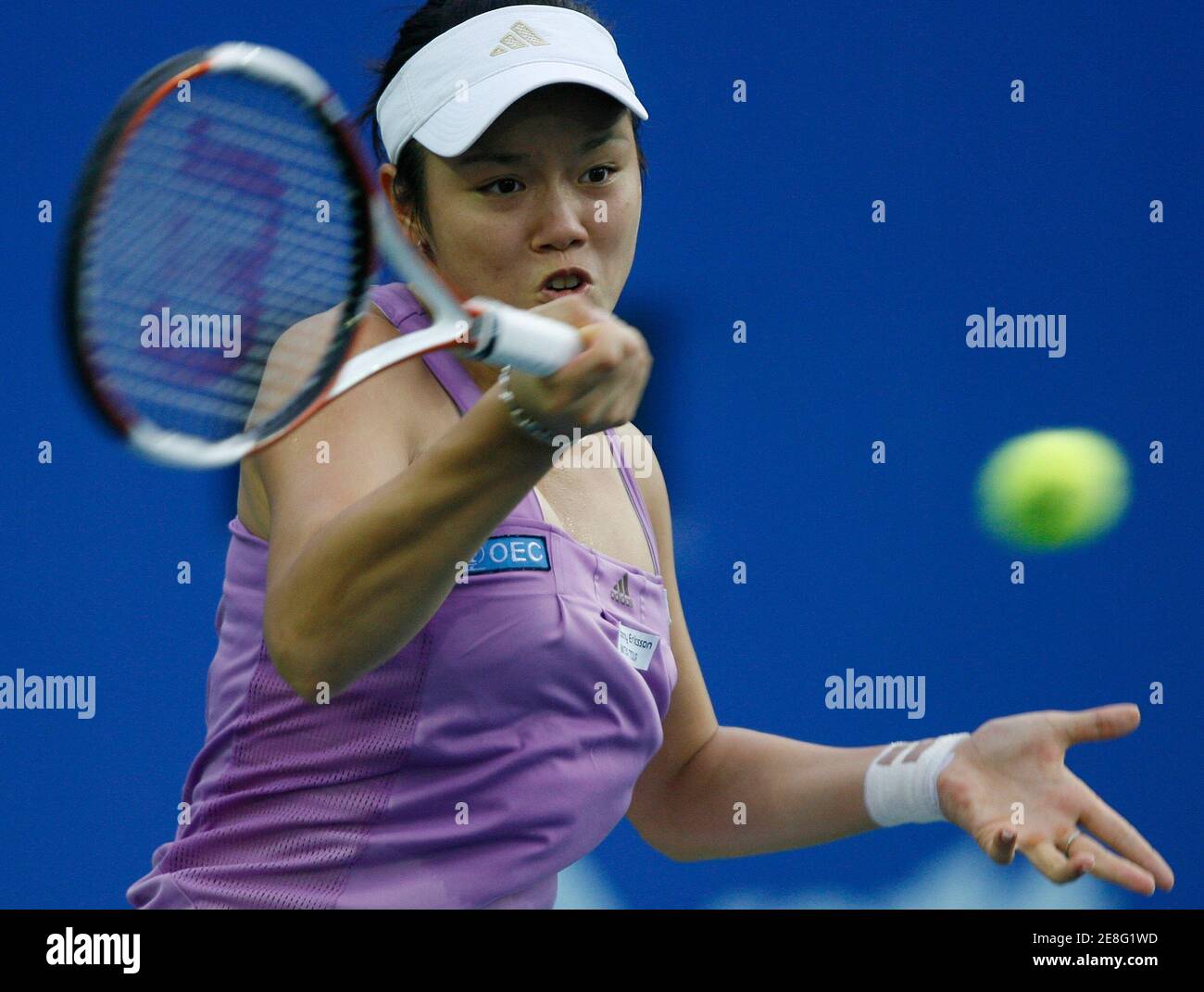 Yung-Jan Chan of Taiwan returns a shot to Zi Yan of China during their semi- final match at the Women's PTT Bangkok Open in Bangkok October 13, 2007. REUTERS/Chaiwat Subprasom (THAILAND) Stock Photo