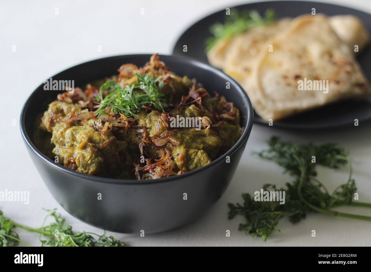 Homemade spicy coriander chicken served with Indian flat bread for