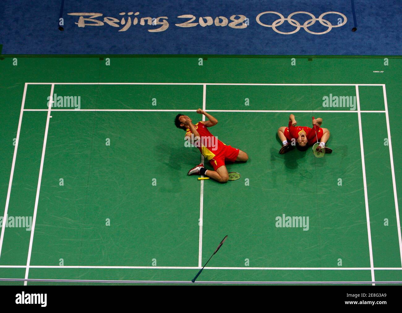 He Hanbin (L) and Yu Yang of China celebrate winning their mixed doubles bronze medal badminton match against Indonesia at the Beijing 2008 Olympic Games August 17, 2008.     REUTERS/Beawiharta (CHINA) Stock Photo