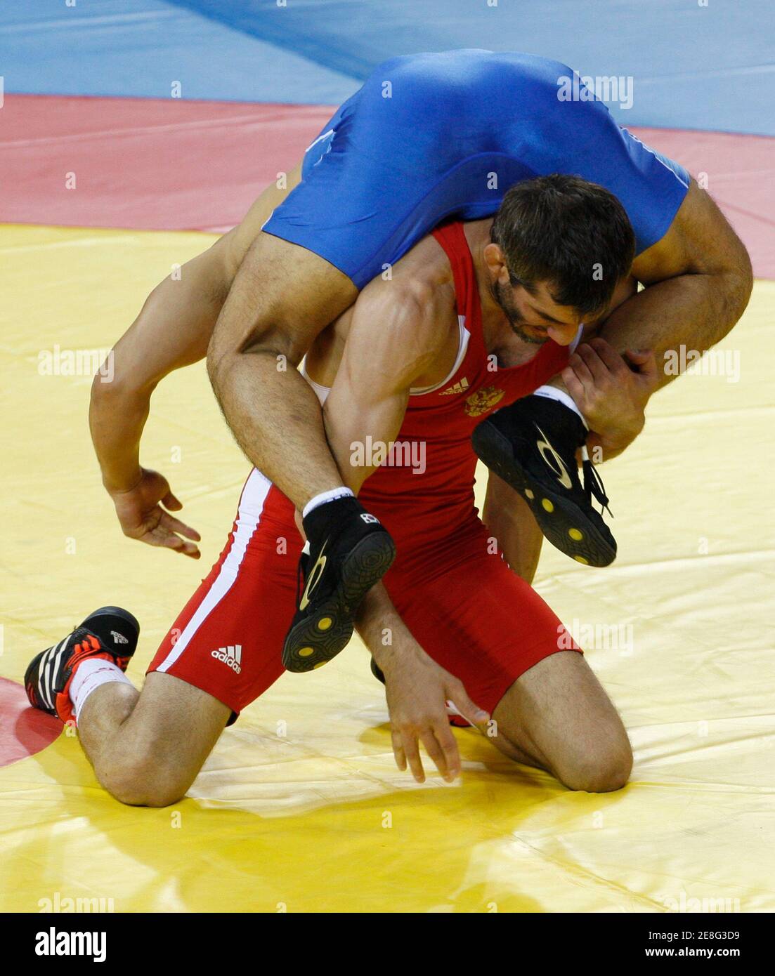 Buvaysa Saytiev of Russia (in red) fights Cho Byung-Kwan of South Korea during their 74kg men's freestyle wrestling qualification match at the Beijing 2008 Olympic Games August 20, 2008. REUTERS/Oleg Popov (CHINA) Stock Photo
