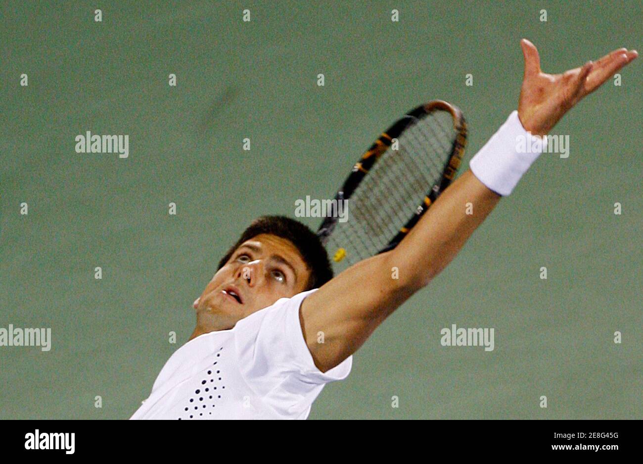 Serbia's Novak Djokovic serves to France's Fabrice Santoro during their match at the ATP Dubai Tennis Championships March 5, 2008. REUTERS/Jumana El Heloueh (UNITED ARAB EMIRATES) Stock Photo