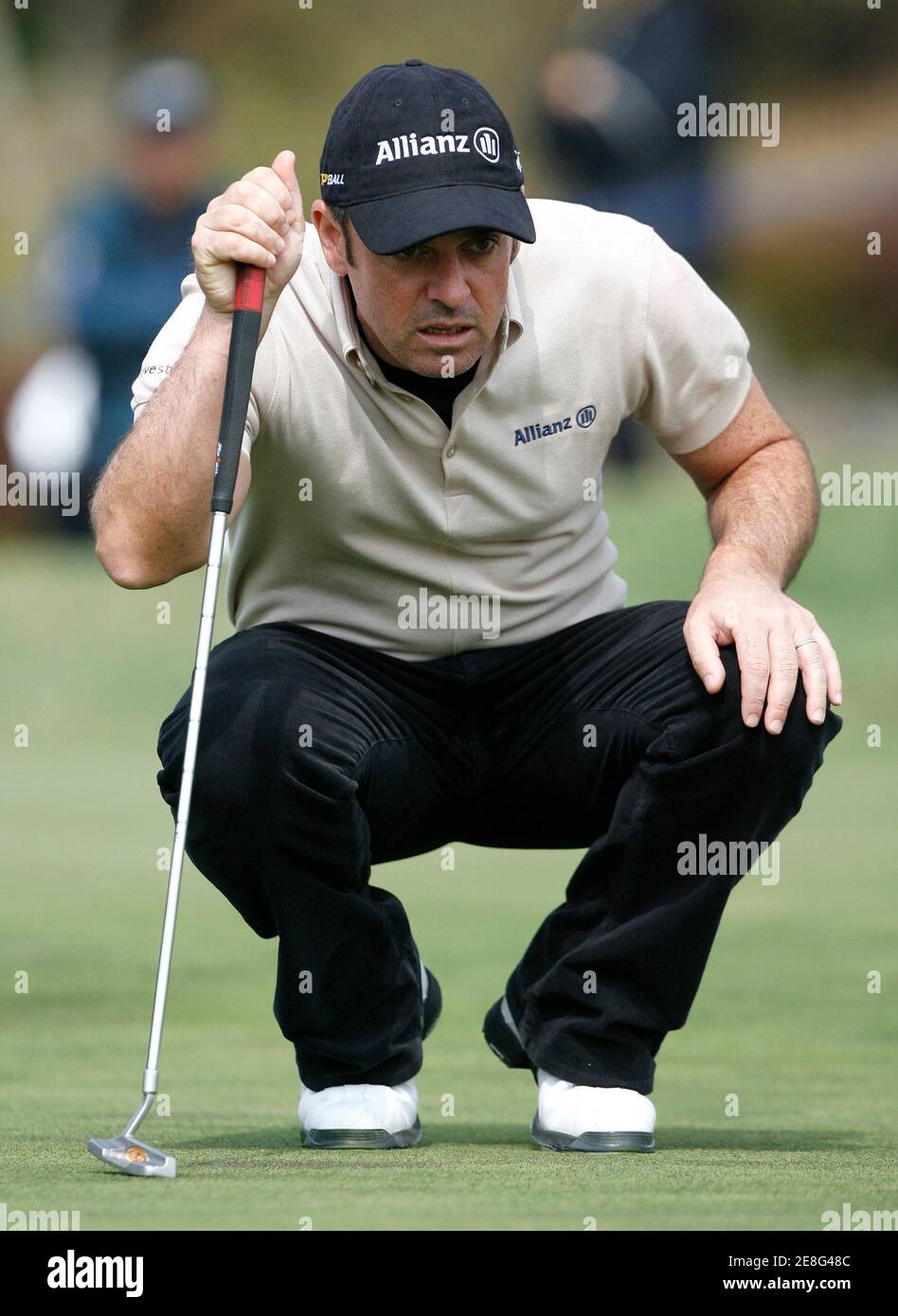 Paul McGinley of Ireland lines up a putt on the 6th green during the final round of the EPGA Ballantine's Championship golf tournament at the Pinx Golf Club in Seogwipo on Jeju Island March 16, 2008.  REUTERS/Jo Yong-Hak (SOUTH KOREA) Stock Photo