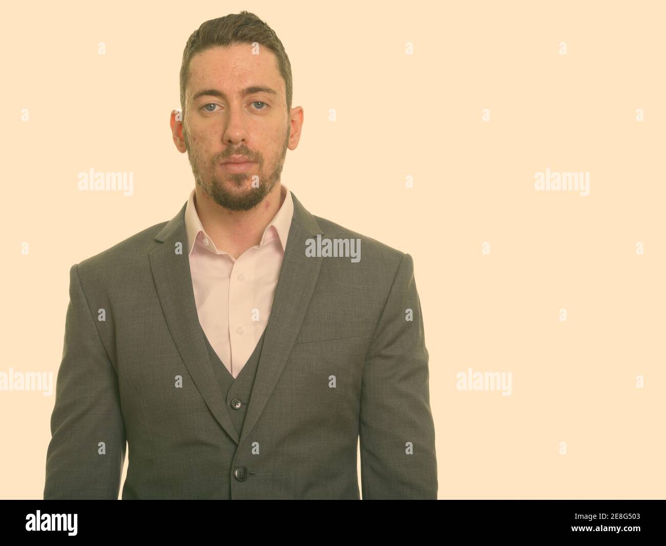 Portrait of young handsome businessman shot in studio Stock Photo - Alamy