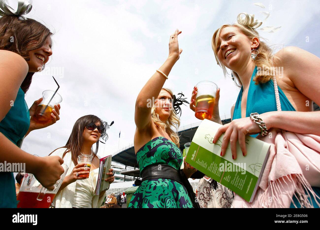 Racegoers wait to watch the first race of the Epsom Derby Festival at Epsom Downs in Surrey, southern England June 6, 2008. REUTERS/Alessia Pierdomenico (BRITAIN) Stock Photo