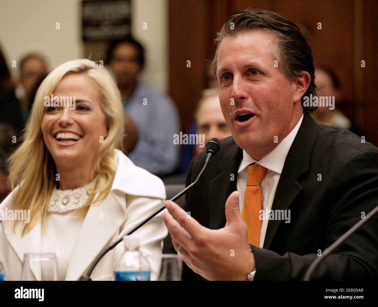 Golfer Phil Mickelson, accompanied by his wife Amy, testifies before the House Education and Labor Committee during a hearing on Innovation in Education through Business and Education STEM Partnerships on Capitol Hill in Washington July 22, 2008. REUTERS/Yuri Gripas (UNITED STATES) Stock Photo
