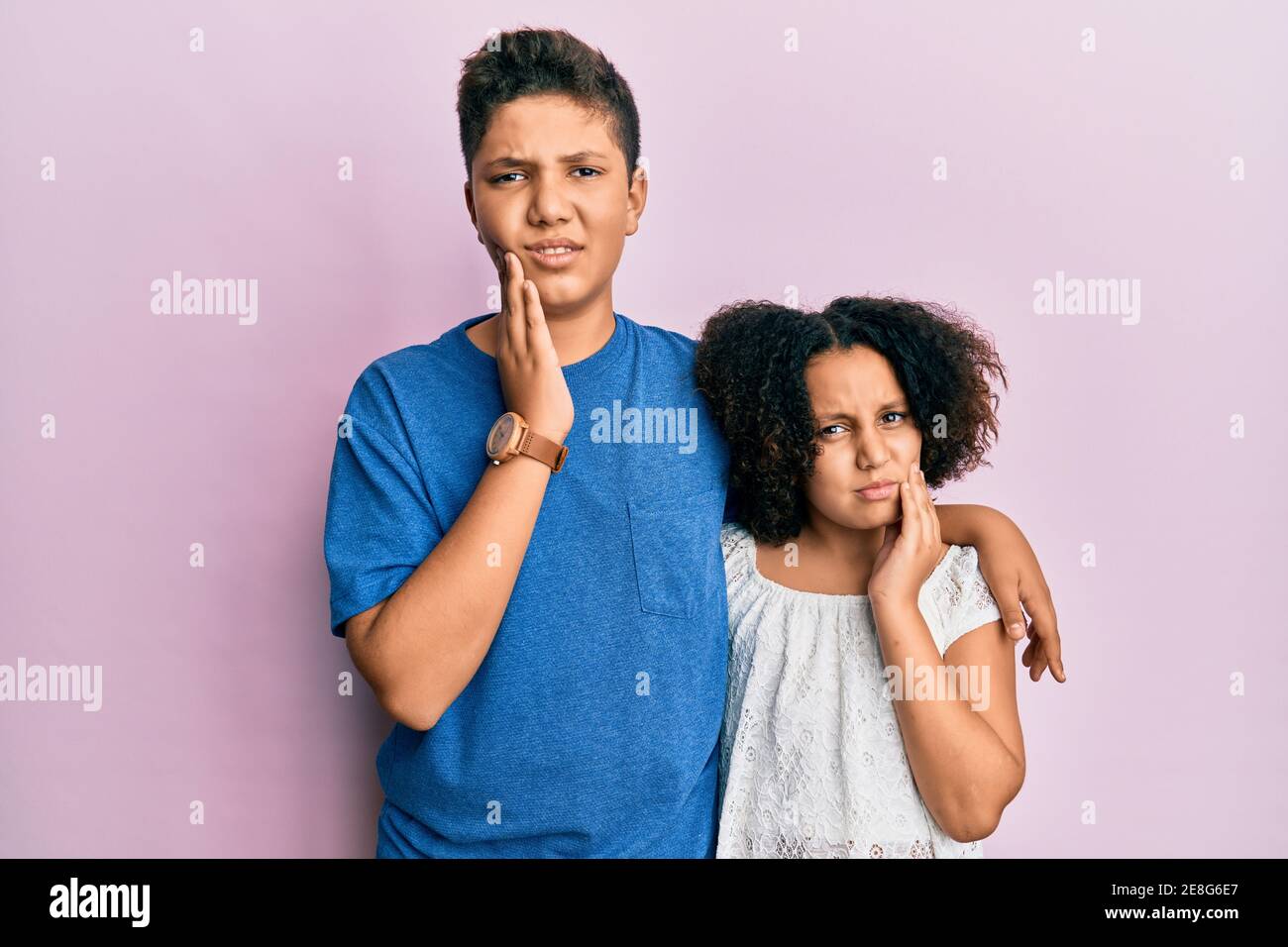 Young hispanic family of brother and sister wearing casual clothes ...